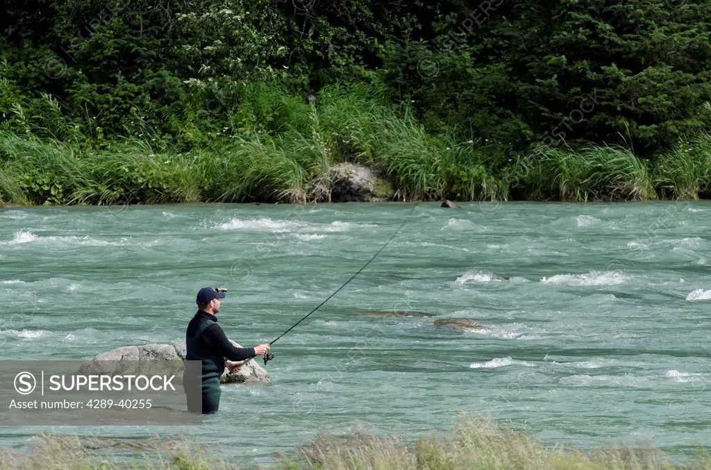 Sport Fishing for sockeye salmon using a spin reel on the Chilkoot River near Haines, Alaska