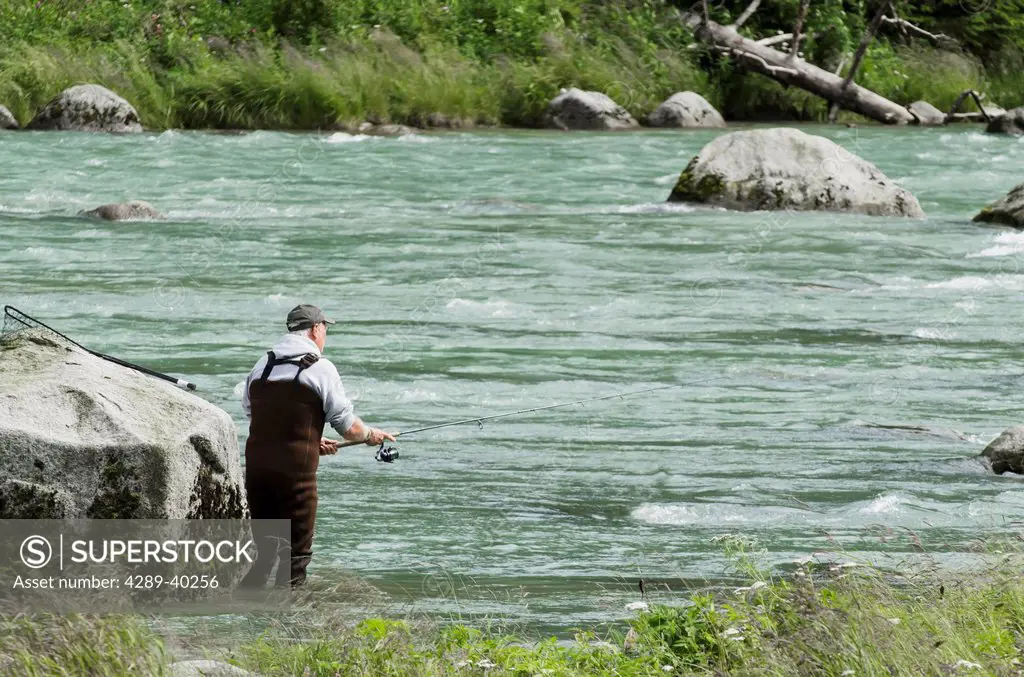 Sport Fishing for sockeye salmon using a spin reel on the Chilkoot River near Haines, Alaska