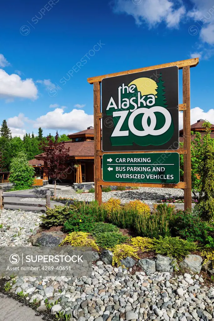 Scenic Of The Alaska Zoo Visitors Center And Entrance Sign On A Sunny Day, Southcentral Alaska, Anchorage, Alaska. Summer.