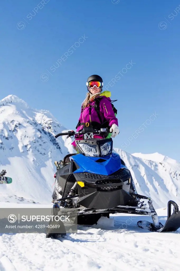 Lynsey Dyer On Her Snowmobile Ready For Some Backcountry Skiing In The Chugach Mountains, Late Winter Southcentral Alaska.