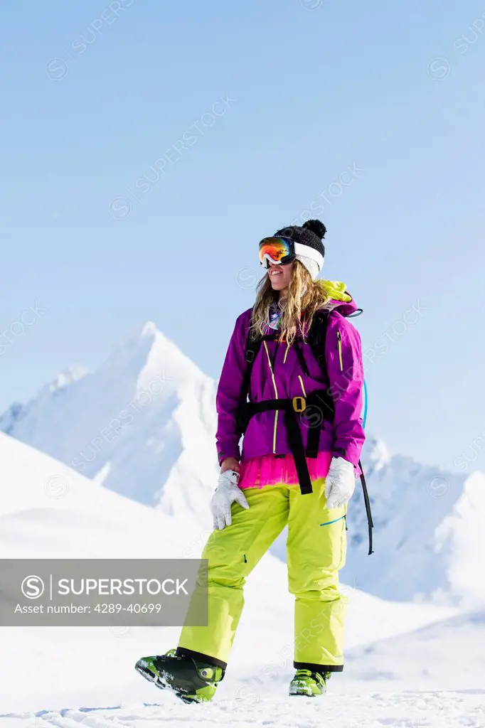 Lynsey Dyer Hanging Out In The Chugach Mountains While Backcountry Skiing By Snowmobile, Late Winter, Southcentral Alaska.