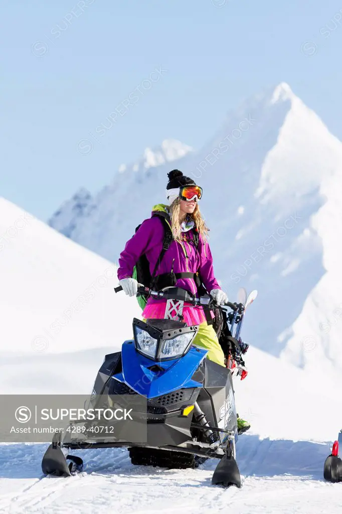 Lynsey Dyer On Her Snowmobile Ready To Do Some Backcountry Skiing In The Chugach Mountains, Late Winter, Southcentral Alaska.