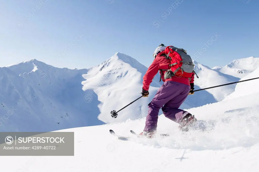 Lizet Christiansen Telemark Skiing In The Chugach Mountains While Backcountry Skiing By Snowmobile In Late Winter, Southcentral Alaska.