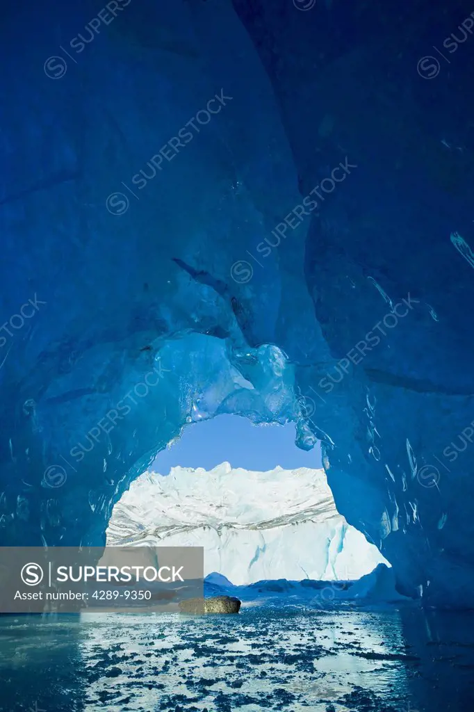 View from inside an ice cave of an iceberg frozen in Mendenhall Lake, Juneau, Southeast Alaska, Winter