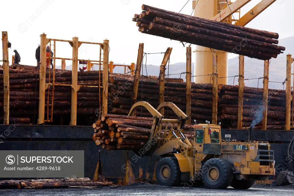 View of log ship being loaded with Sitka Spruce from Chiniak and Sequel Point at LASH dock in Women´s Bay, Kodiak Island, Southwest Alaska, Autumn