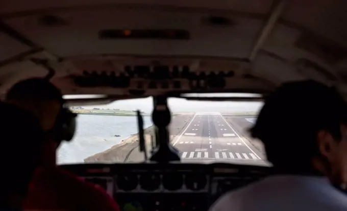 POV view through windshiled of an airplane as it is landing on the runway at Kotzebue, Arctic Alaska, Summer