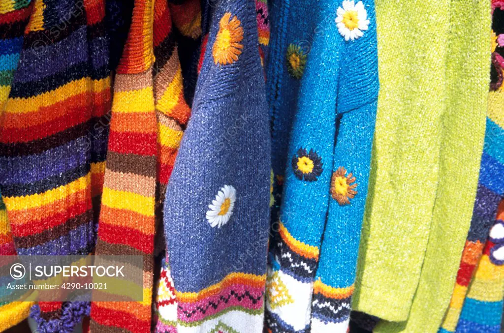 Colourful knitwear for sale outside clothing shop, Inka Market, Lima, Peru