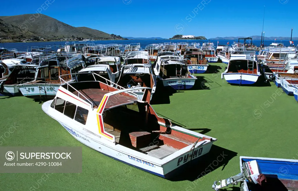 Boats moored in Puno Harbour, on Lake Titicaca, Puno, Peru