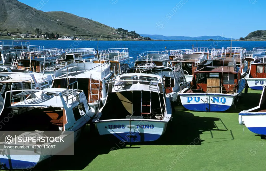 Boats moored in Puno Harbour, on Lake Titicaca, Puno, Peru