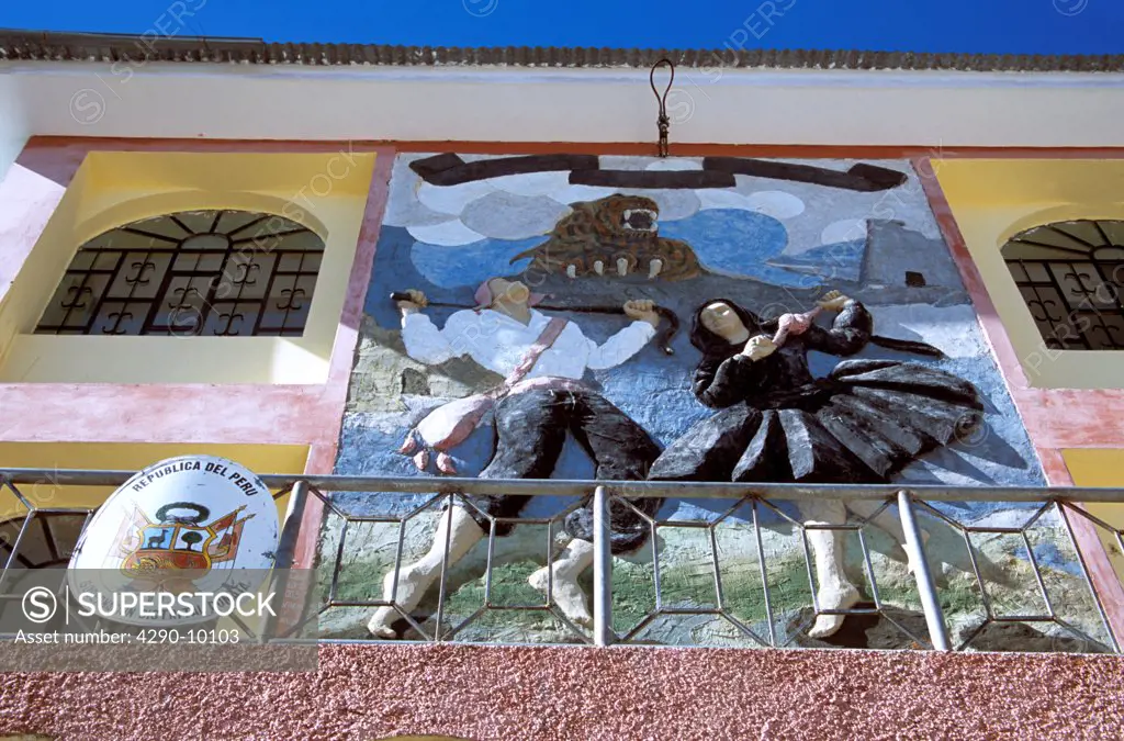 Wall sculpture of man and woman dancing, Pomata, Peru