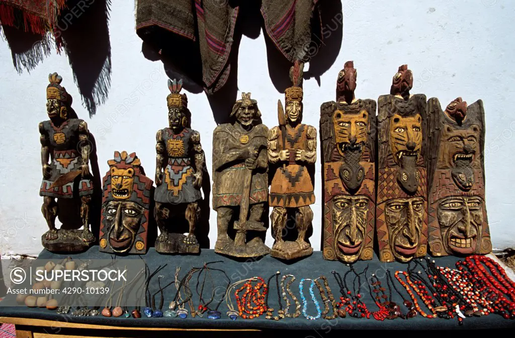 Carved wooden gifts outside gift shop, Pisac Market, Pisac, near Cusco, Peru