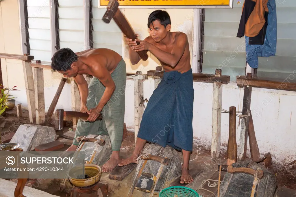 Men making gold leaf, King Galon Gold Leaf Workshop, Mandalay, Myanmar, (Burma)