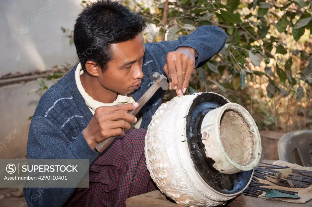 Silversmith making silver bowl, U Ba Mhin Daw Khin Lay Company, Ywa Htaung, Sagaing, Mandalay, Myanmar, (Burma)