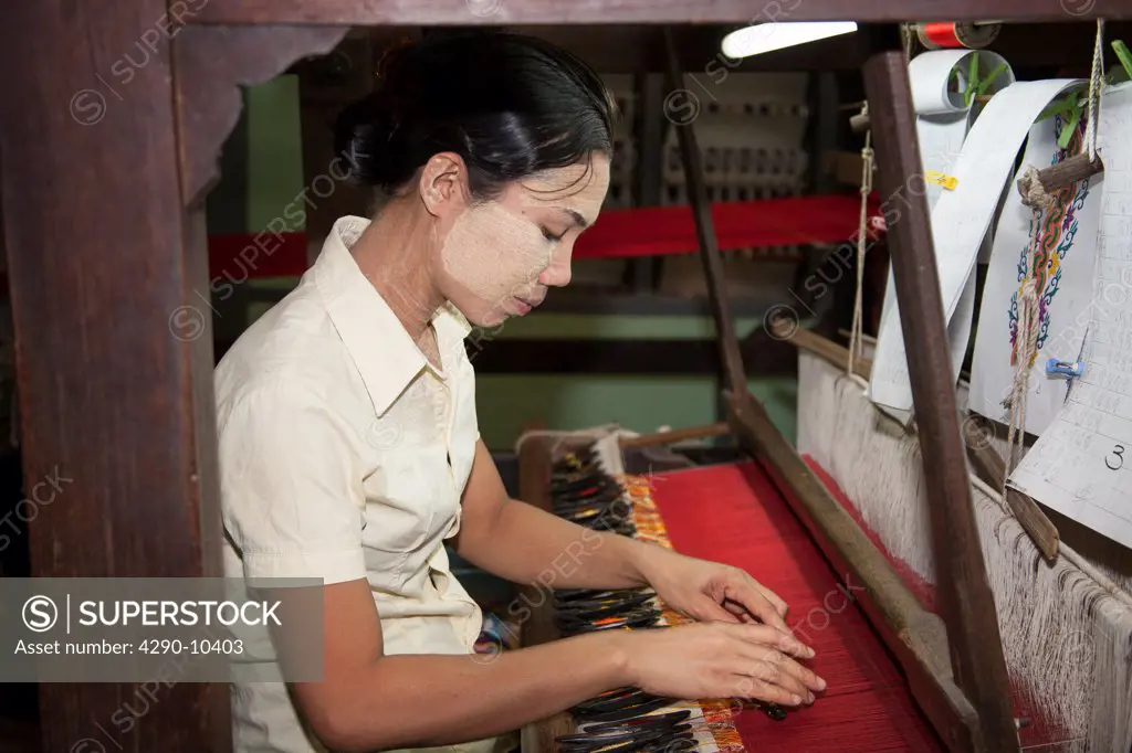 Woman weaving on a loom, Thein Nyo silk weaving workshop, Amarapura, Mandalay, Myanmar, (Burma)