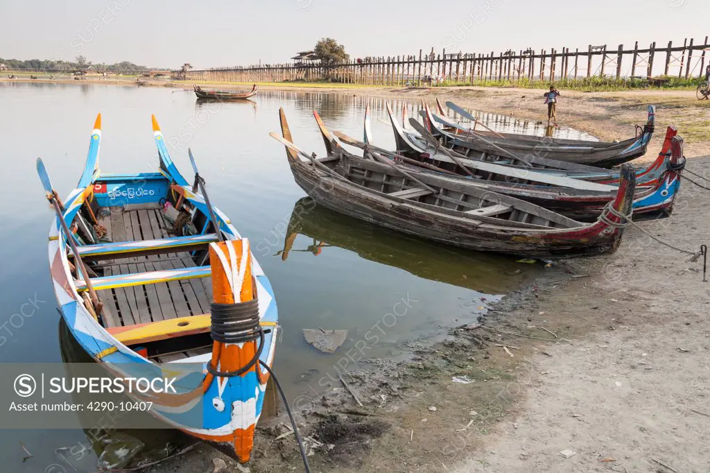 Boats on Taungthaman Lake beside U Bein wooden bridge, Amarapura, Mandalay, Myanmar, (Burma)