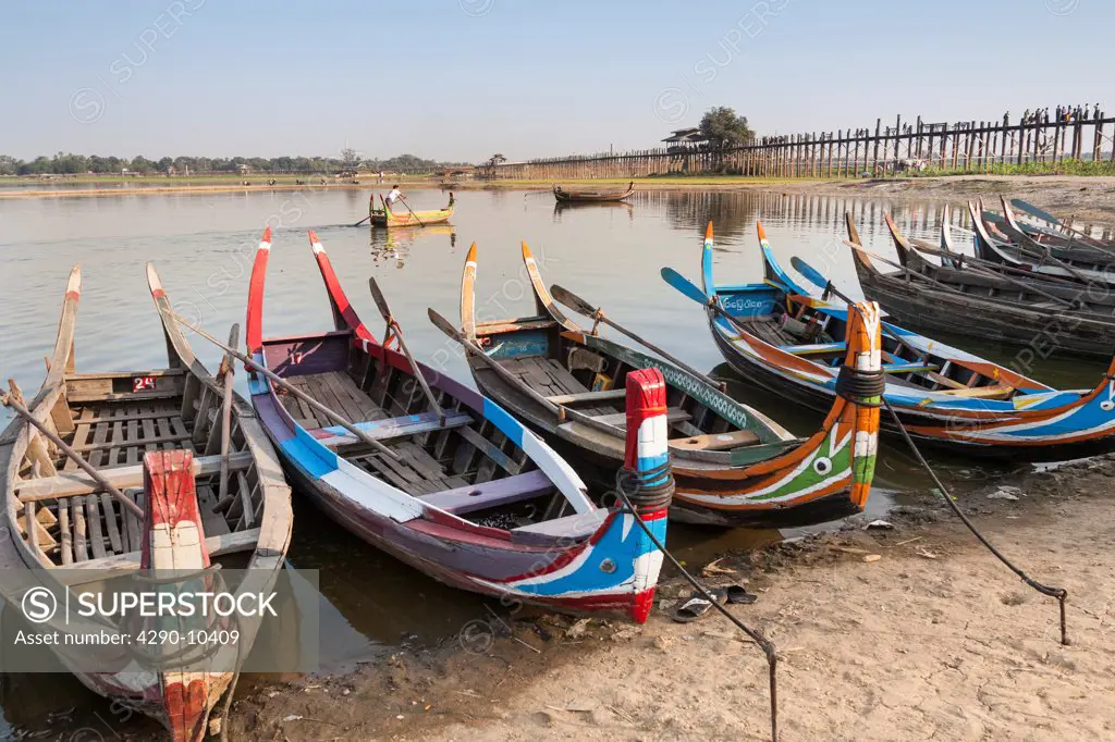 Boats on Taungthaman Lake beside U Bein wooden bridge, Amarapura, Mandalay, Myanmar, (Burma)