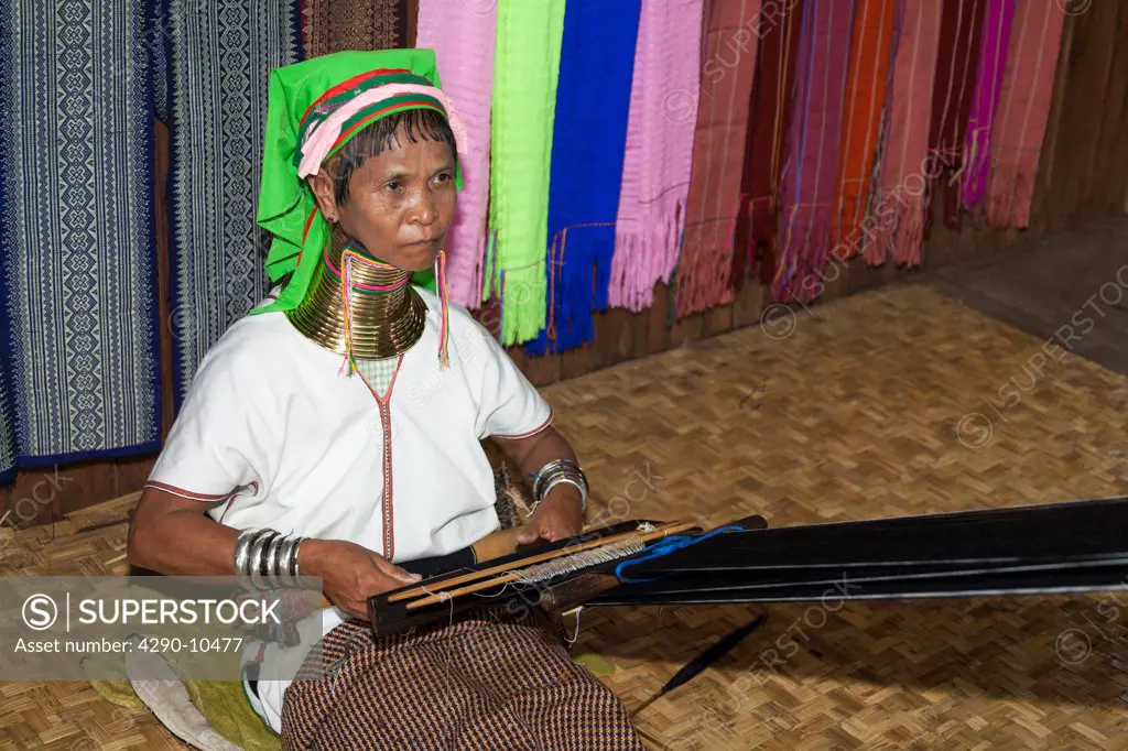 Woman with long neck from the Padaung tribe weaving, Ywama village, Inle Lake, Shan State, Myanmar, (Burma)