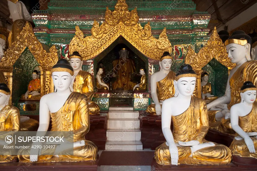 Buddha statues in a prayer hall at Shwedagon Pagoda, Yangon, (Rangoon), Myanmar, (Burma)