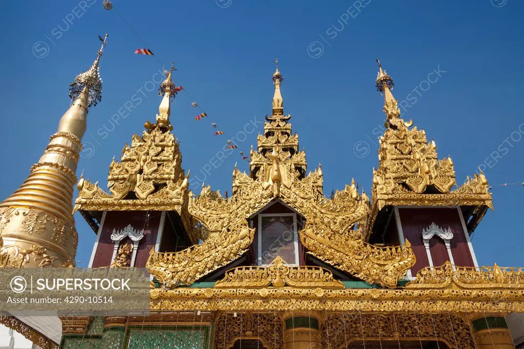 Ornate roof of a building and a stupa at Shwedagon Pagoda, Yangon, (Rangoon), Myanmar, (Burma)
