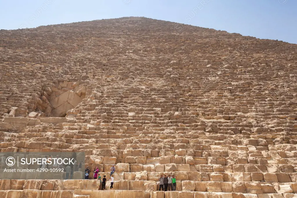 Tourists at the Great Pyramid in Giza Necropolis, Giza, Cairo, Egypt