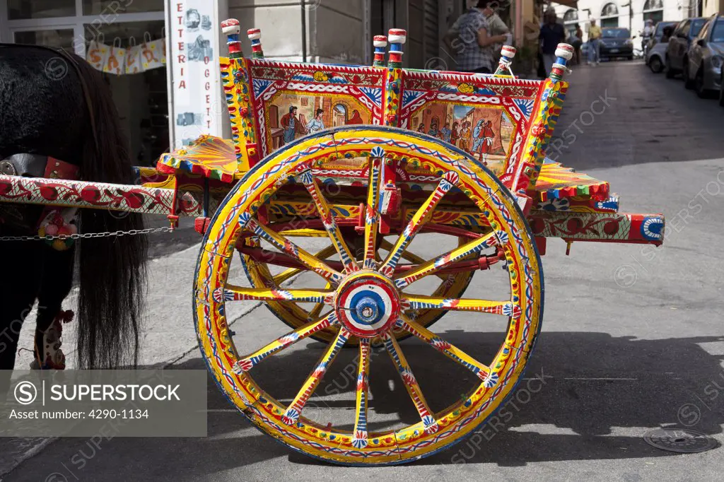 Colourful cart and cartwheel, Monreale, near Palermo, Sicily, Italy