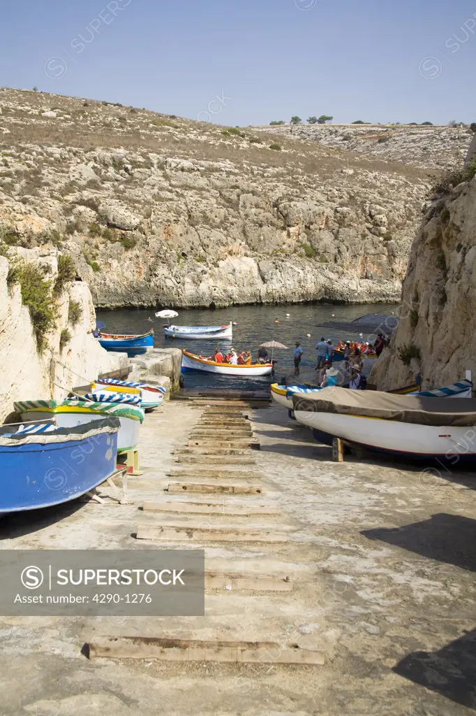 Tourists and boats in the harbour, Blue Grotto, Wied Iz Zurrieq, Malta