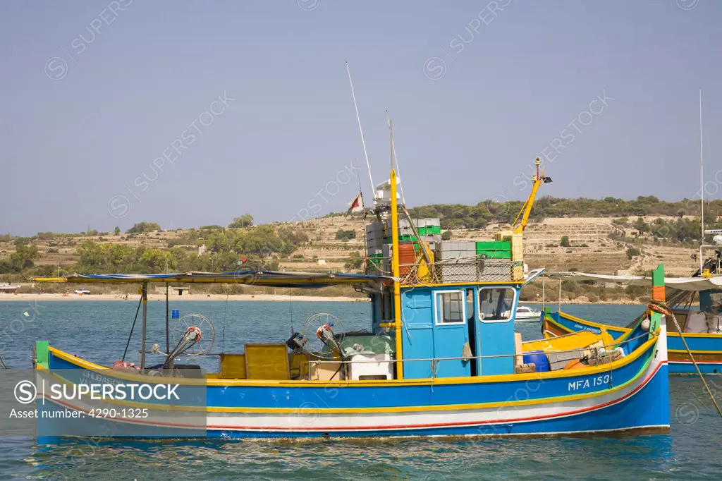 Luzzu fishing boat moored in Marsaxlokk Harbour, Marsaxlokk, Malta