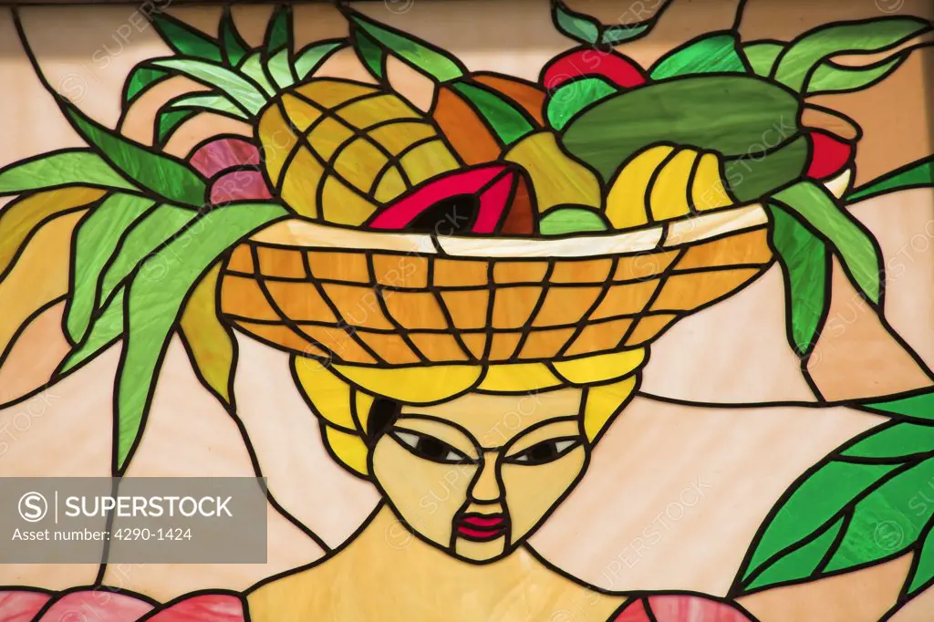 Colourful stained glass window of woman carrying basket of fruit on her head, Trinidad, Sancti Spiritus, Cuba
