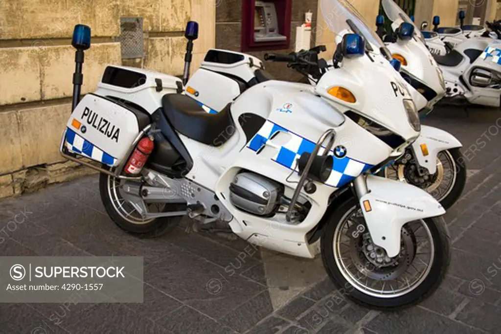 Police motorcycles parked in a street, Valletta, Malta