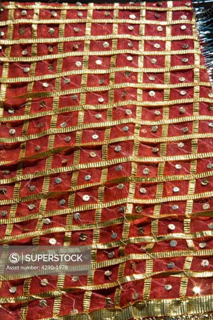 A colourful shawl for sale outside a shop beside Sachiya Mata Temple, Osian, near Jodhpur, Rajasthan, India