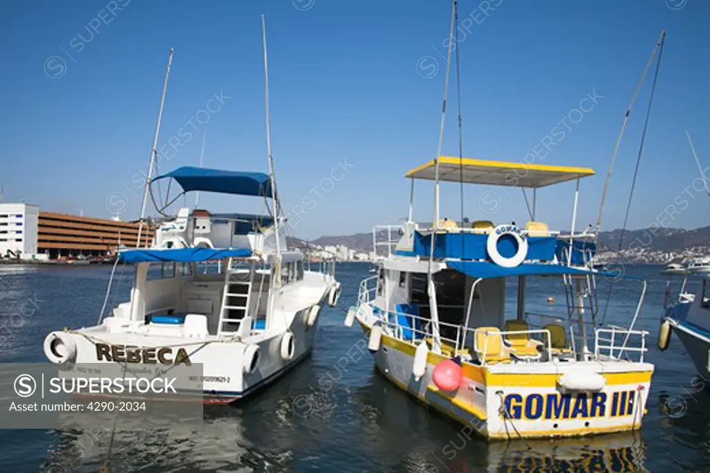 Two boats moored in the harbour, Acapulco, Guerrero State, Mexico