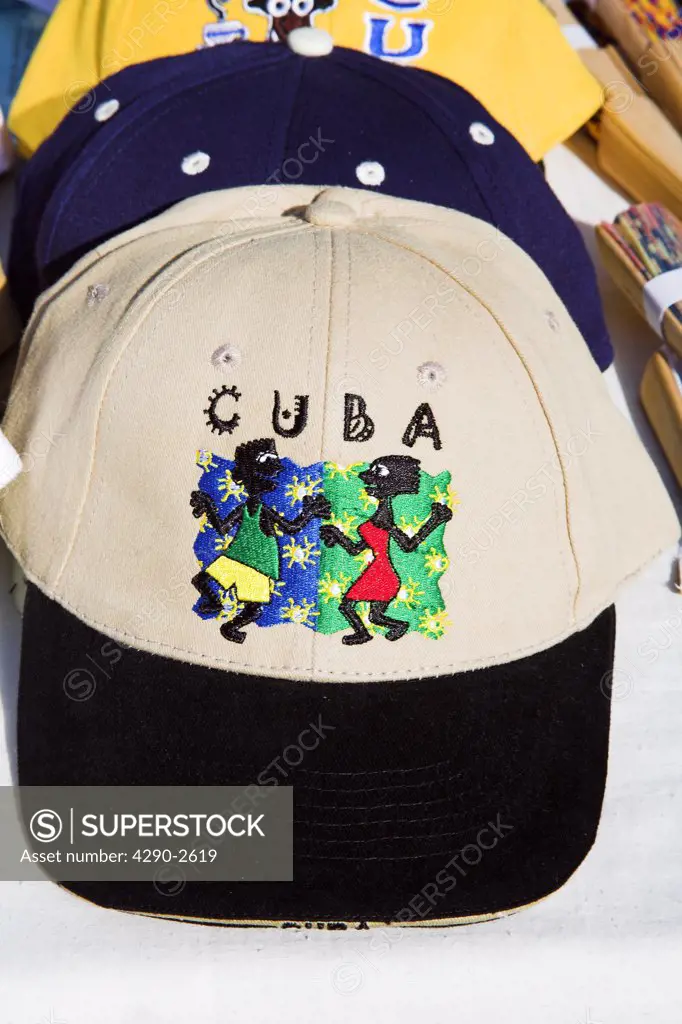 Baseball cap incorporating dancers motif, on a market stall, Craft Market, Guardalavaca, Holguin Province, Cuba