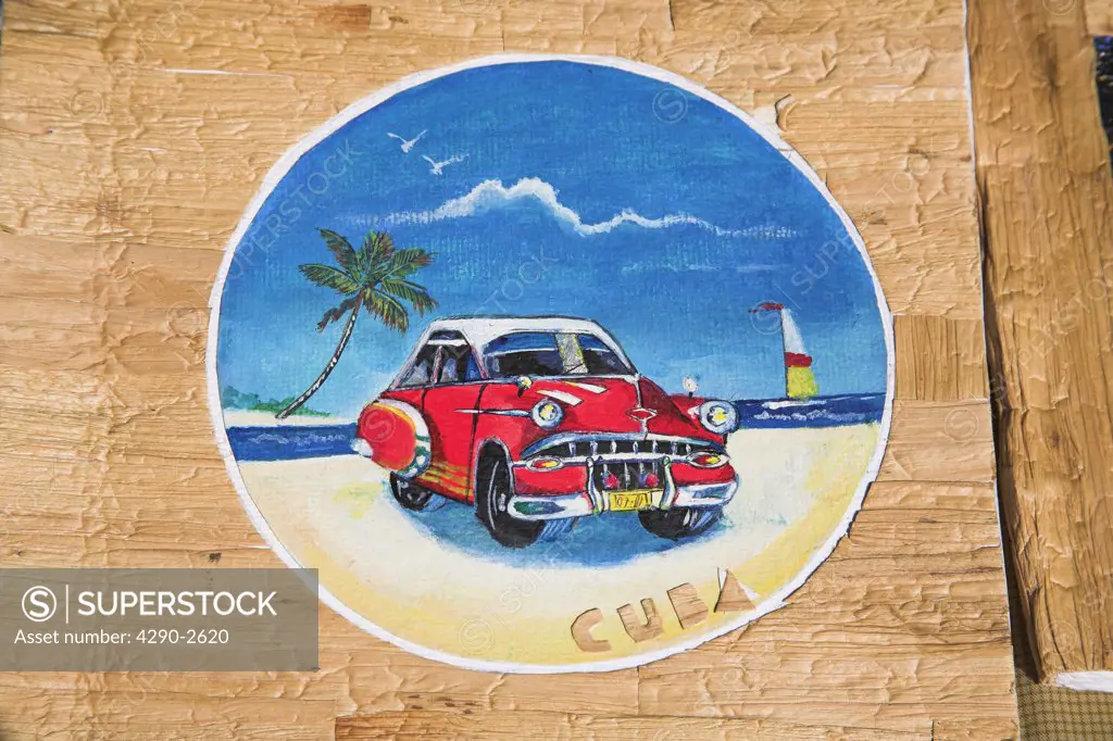 Painting of car on photo album on market stall in the Craft Market, Guardalavaca, Holguin Province, Cuba