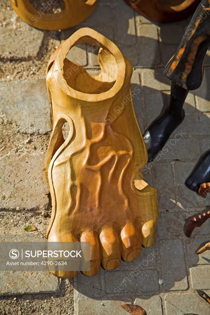 Wood carving of a human adult foot for sale in the Craft Market, Guardalavaca, Holguin Province, Cuba
