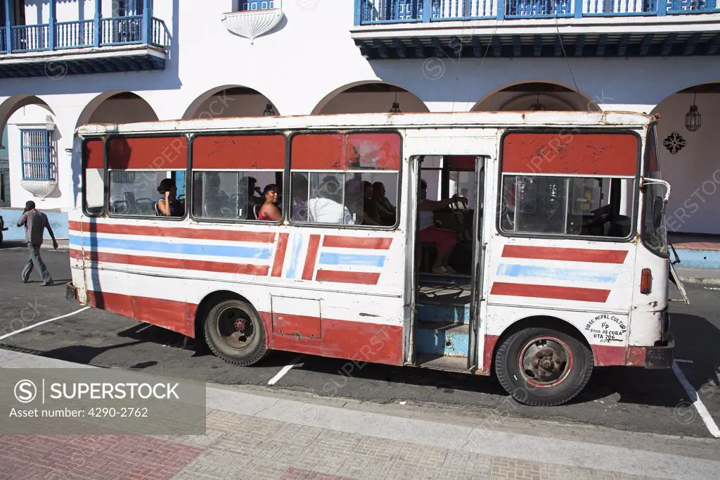 Passengers on board a bus, outside Ayuntamiento, Town Hall, Parque Cespedes, Santiago de Cuba, Cuba