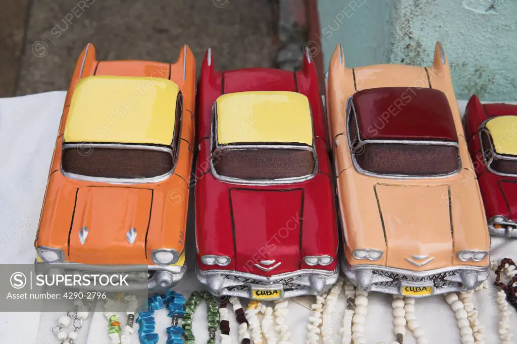 Three model classic American cars for sale in a market, Havana, Cuba