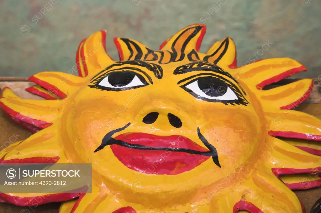Colourful ceramic pottery sun wall plaque for sale in craft market, Trinidad, Sancti Spiritus Province, Cuba