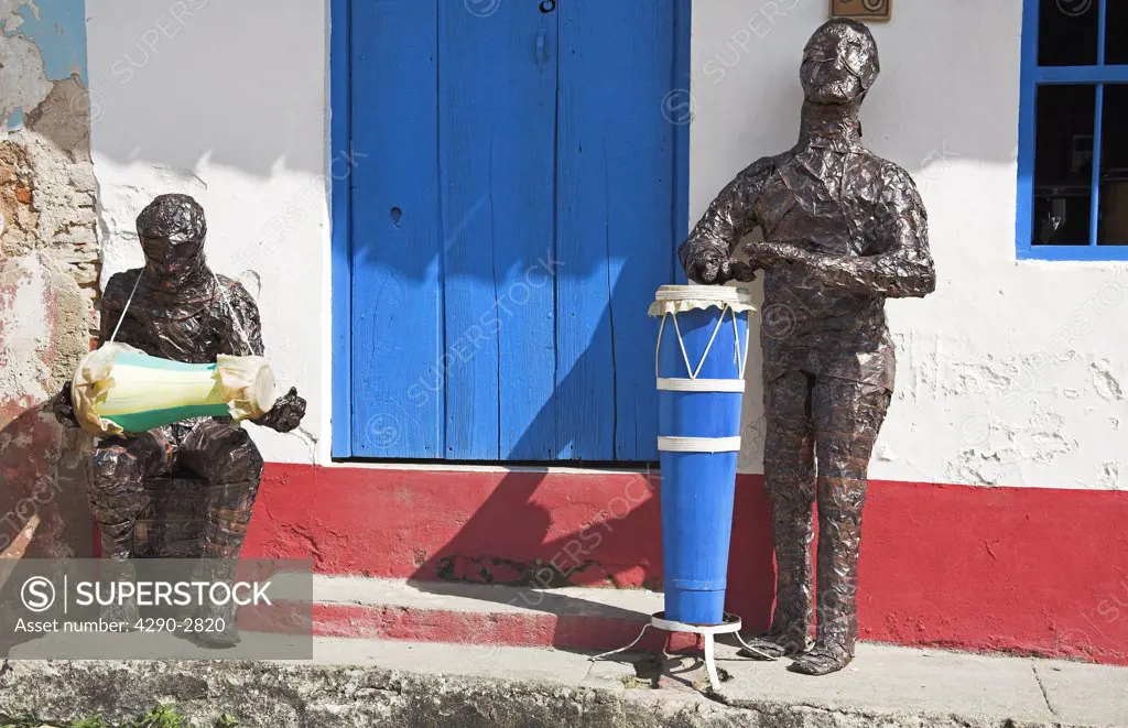 Models of musicians playing bongo drums outside a building, Trinidad, Sancti Spiritus Province, Cuba