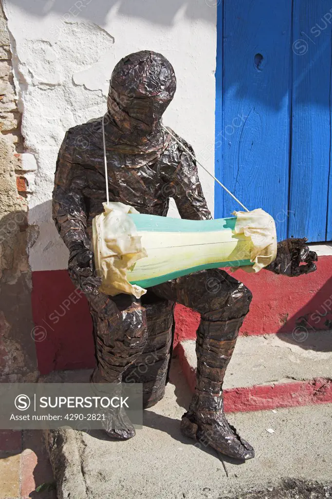 Model of musician playing bongo drum outside a building, Trinidad, Sancti Spiritus Province, Cuba
