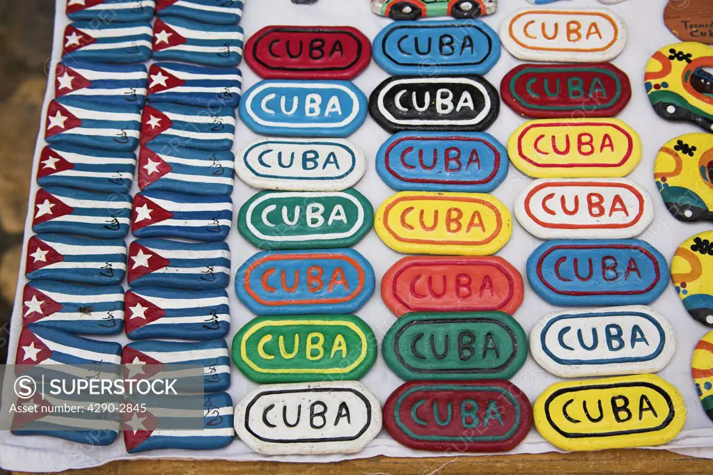 Cuban flag and place name fridge magnets on stall, Trinidad, Sancti Spiritus Province, Cuba