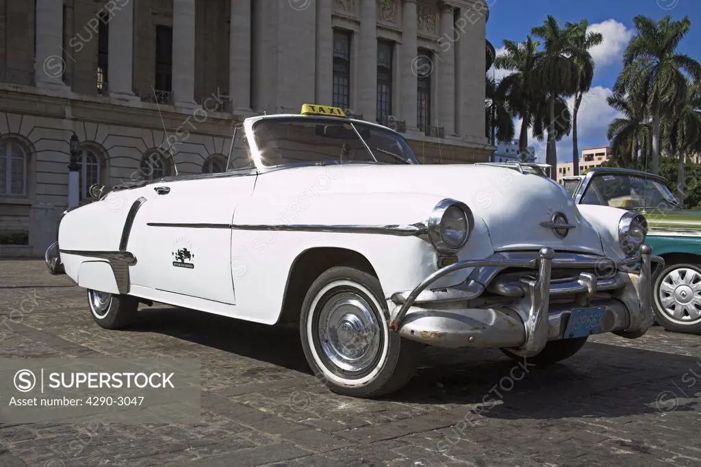 Classic American white Oldsmobile convertible open top taxi, Havana, La Habana Vieja, Cuba