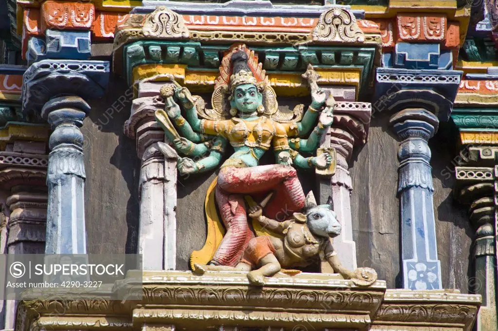 Carved female figure with eight arms on a gopuram, Meenakshi Temple, Madurai, Tamil Nadu, India