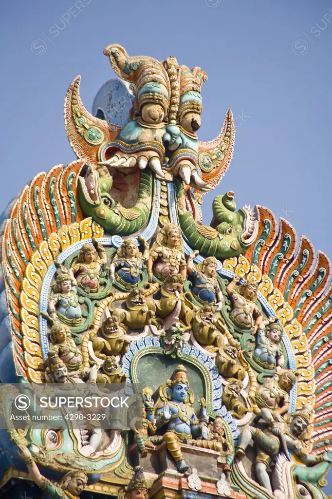 Carved figures on top of a gopuram, Meenakshi Temple, Madurai, Tamil Nadu, India