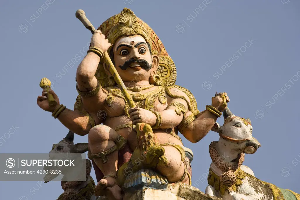 Carved Hindu four armed deity, Meenakshi Temple, Madurai, Tamil Nadu, India
