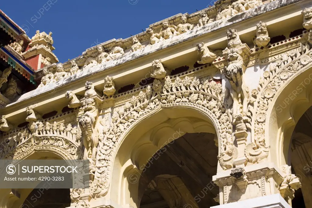 Carved animals and arches on outside wall of Thirumalai Nayak Palace, Madurai, Tamil Nadu, India