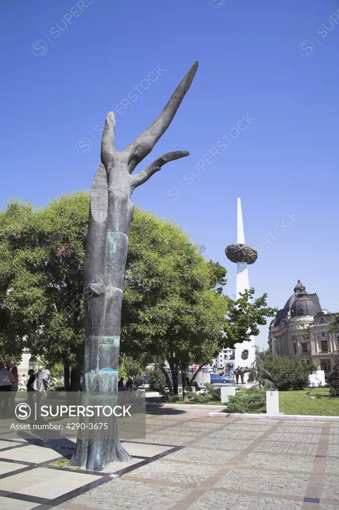 Statue of broken man and Monument to 1989 Revolution, Rebirth Memorial, Piata Revolutiei, Bucharest, Romania