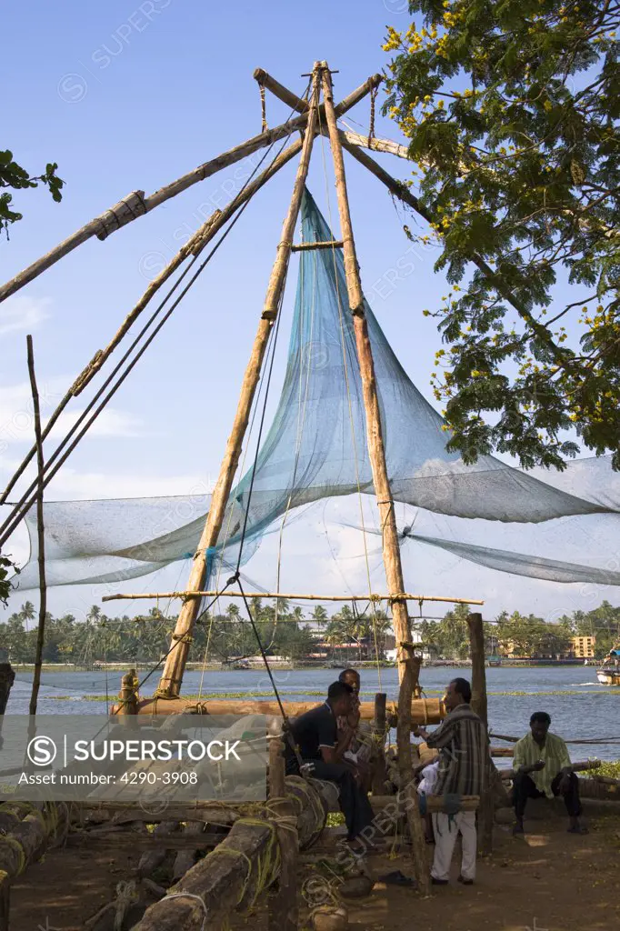 Chinese fishing nets, and fishermen, Fort Cochin, Cochin, Kerala, India