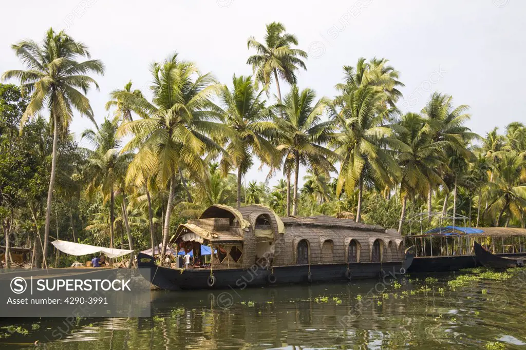 A Kettu Vallam houseboat moored on the river, near Alleppey, Kerala, India