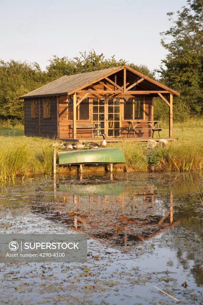 A summerhouse beside a lake, Wiltshire, England