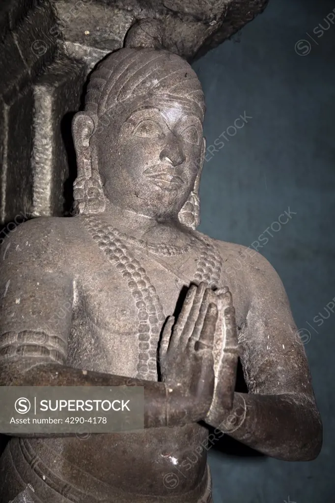 Carved figure of a man praying, Meenakshi Temple, Madurai, Tamil Nadu, India